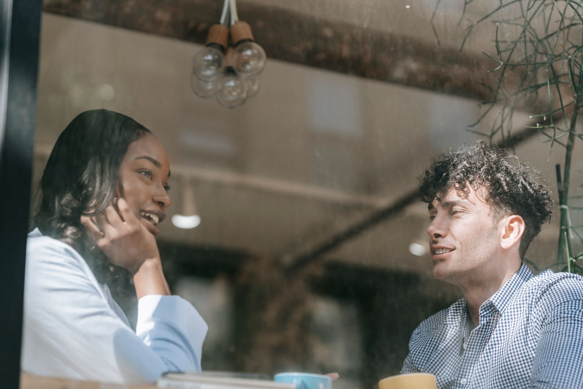 Two people enjoying a warm, relaxed conversation — the feeling of being heard.